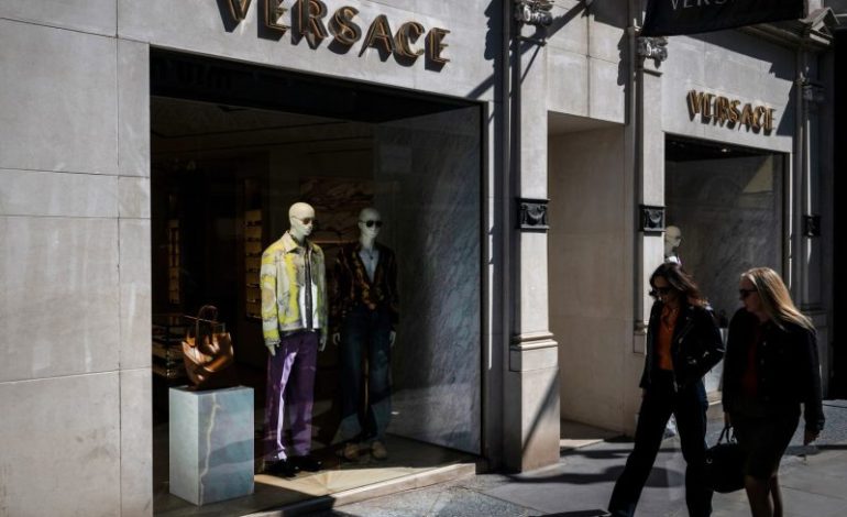  Prada Group says it has purchased fashion rival Versace in a deal worth nearly $1.4 billion
